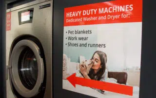 A sign displaying the words "Heavy Duty Machines," indicating the presence of robust industrial equipment.