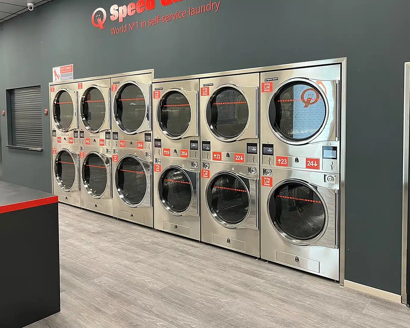 An laundry store in Cantabria showcasing several washing machines, ready for use in a clean and functional environment.