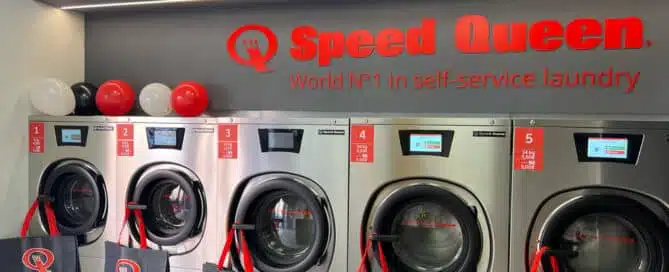 Speed Queen washer-extractors in a self-service laundry in Madrid.